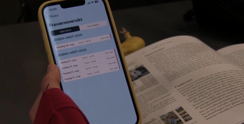 en telefon som viser NOA og fraværgrense